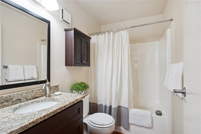 full bathroom with curtained shower, vanity, and toilet