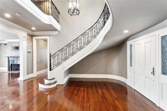 54 Beresford Dr, Metairie, LA 70001 - entryway with stairway, baseboards, wood finished floors, ornamental molding, and decorative columns