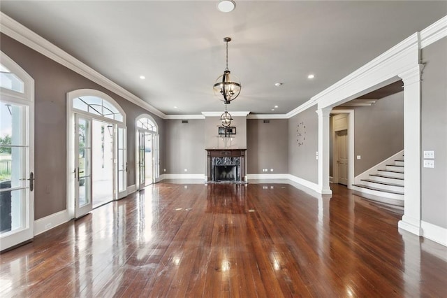 54 Beresford Dr, Metairie, LA 70001 - unfurnished living room with hardwood / wood-style floors, baseboards, a fireplace, recessed lighting, and crown molding