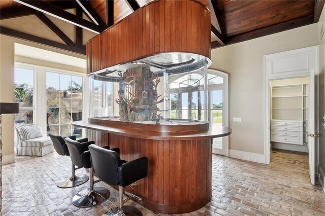 54 Beresford Dr, Metairie, LA 70001 - indoor dry bar with healthy amount of natural light, baseboards, brick floors, and wood ceiling