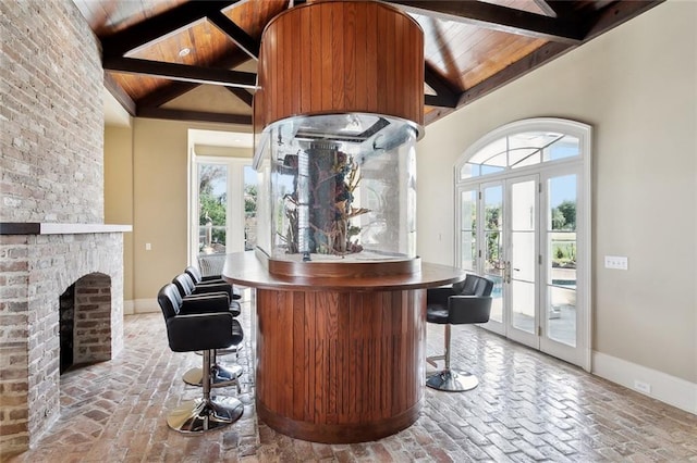 54 Beresford Dr, Metairie, LA 70001 - indoor dry bar with wooden ceiling, plenty of natural light, french doors, baseboards, and beam ceiling