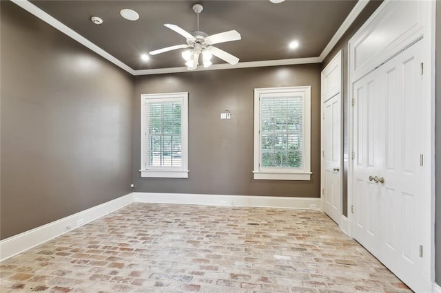 54 Beresford Dr, Metairie, LA 70001 - entryway featuring crown molding, baseboards, brick flooring, ceiling fan, and recessed lighting