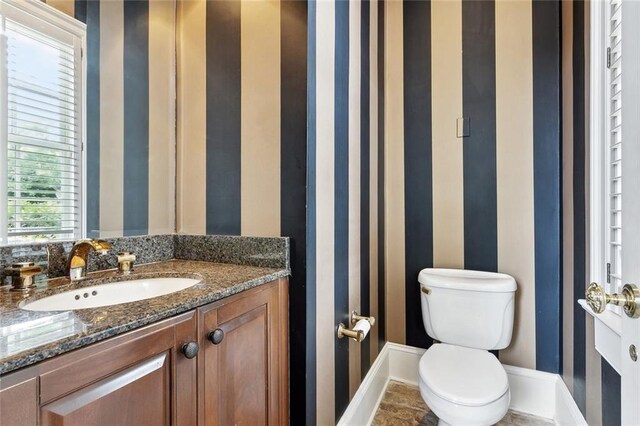 54 Beresford Dr, Metairie, LA 70001 - bathroom with baseboards, toilet, and vanity