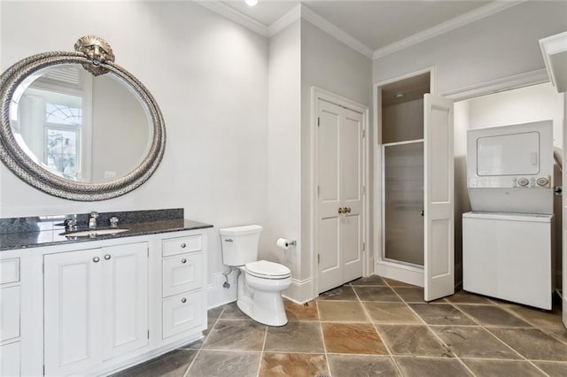 54 Beresford Dr, Metairie, LA 70001 - full bathroom with stacked washer / drying machine, a stall shower, ornamental molding, baseboards, and vanity