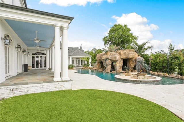 54 Beresford Dr, Metairie, LA 70001 - swimming pool with french doors, a patio, a ceiling fan, and a lawn