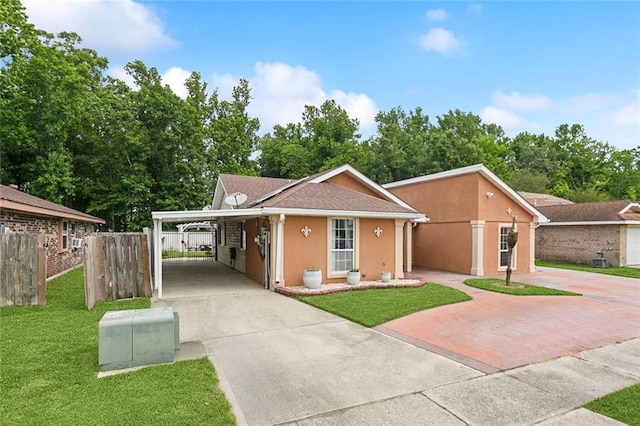 2930 Laurie Ln, Marrero, LA 70072 - view of front of home with concrete driveway, stucco siding, and an attached carport
