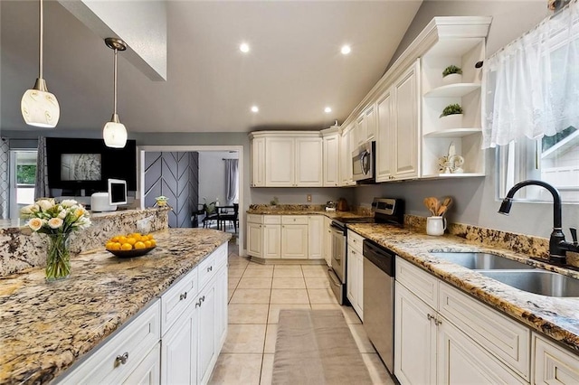 2930 Laurie Ln, Marrero, LA 70072 - kitchen with a sink, appliances with stainless steel finishes, open shelves, light stone countertops, and pendant lighting