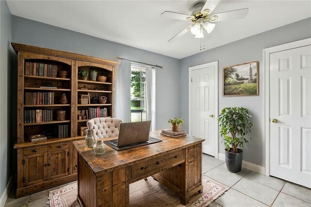2930 Laurie Ln, Marrero, LA 70072 - office featuring ceiling fan, light tile patterned floors, and baseboards