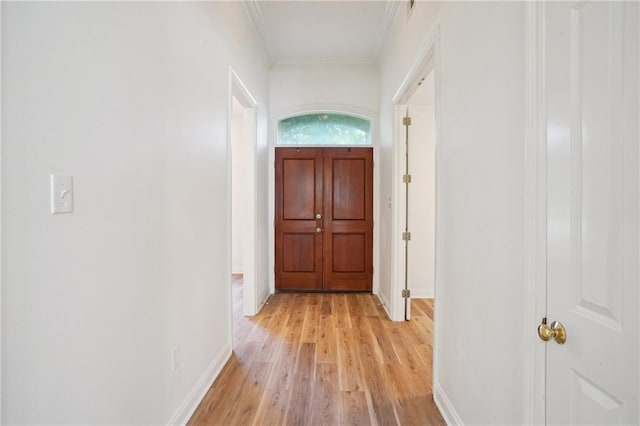125 Secluded Forest Way, Madisonville, LA 70447 - hall with crown molding, light wood-style flooring, and baseboards