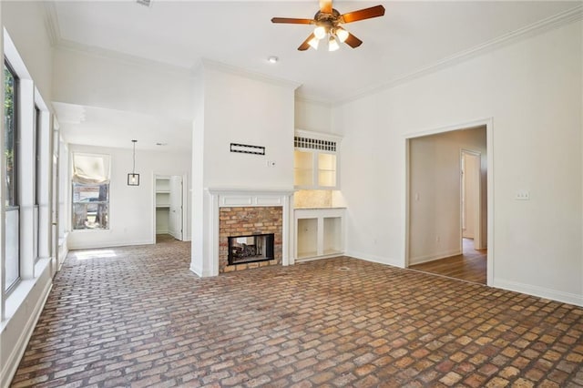 125 Secluded Forest Way, Madisonville, LA 70447 - unfurnished living room featuring ceiling fan, brick patterned floors, baseboards, and ornamental molding