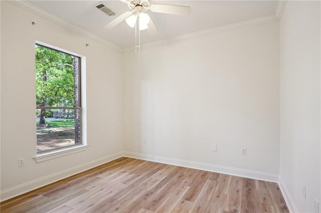 125 Secluded Forest Way, Madisonville, LA 70447 - spare room featuring light wood-style floors, crown molding, a ceiling fan, and baseboards