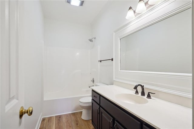 125 Secluded Forest Way, Madisonville, LA 70447 - full bath featuring toilet, wood finished floors, vanity, and shower / bath combination