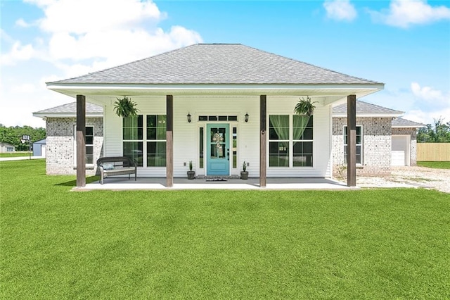 19916 Church Branch Rd, Springfield, LA 70462 - back of property featuring a shingled roof, a yard, an attached garage, and a porch