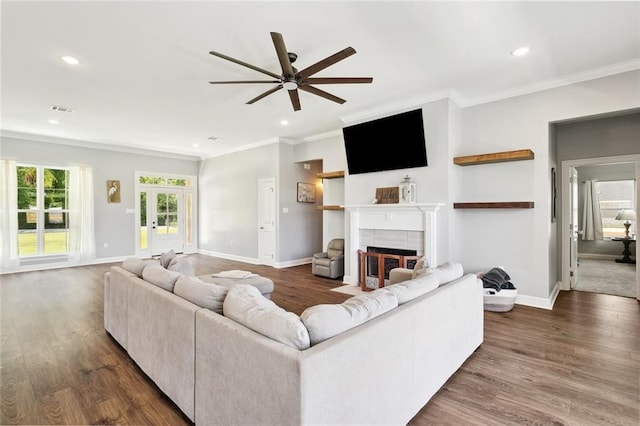 19916 Church Branch Rd, Springfield, LA 70462 - living area with ceiling fan, crown molding, a tiled fireplace, recessed lighting, and baseboards