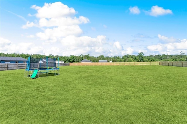 19916 Church Branch Rd, Springfield, LA 70462 - view of yard featuring a trampoline