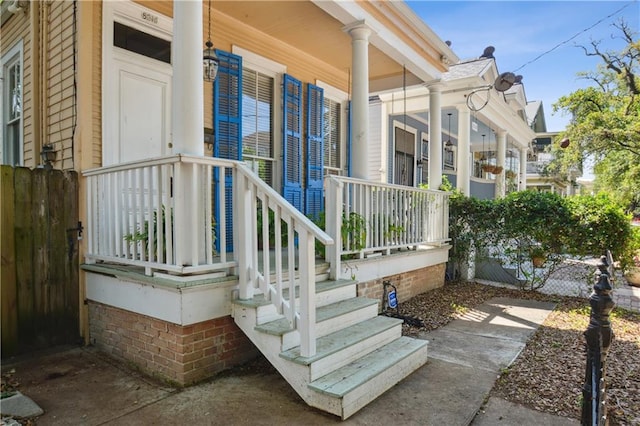 8216 Spruce St, New Orleans, LA 70118 - entrance to property with a porch