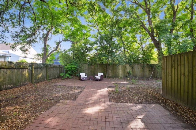 8216 Spruce St, New Orleans, LA 70118 - fenced backyard with a patio area