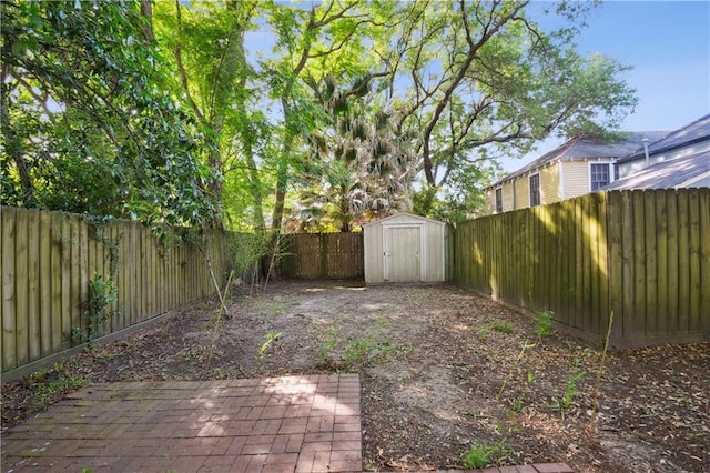 8216 Spruce St, New Orleans, LA 70118 - fenced backyard with a storage unit, an outbuilding, and a patio