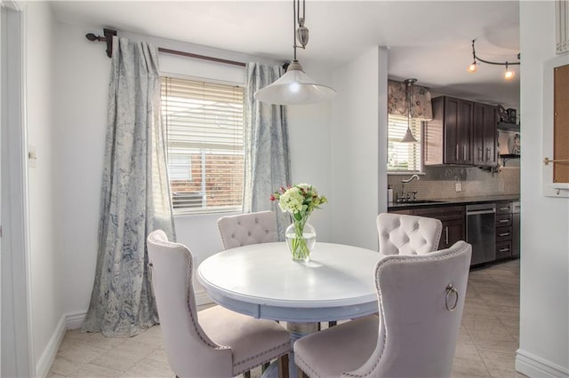 dining area featuring baseboards