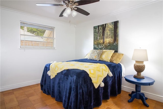 bedroom with crown molding, baseboards, and a ceiling fan