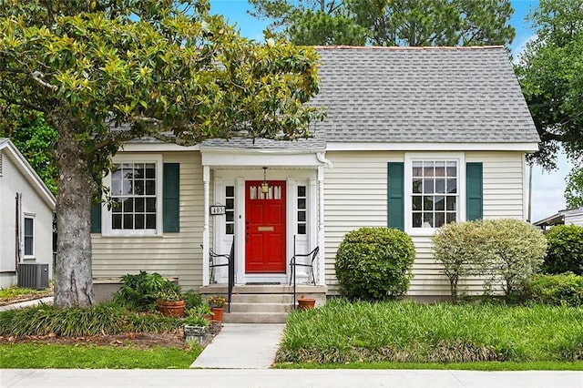 403 Athania Pkwy, Metairie, LA 70001 - view of front of home featuring roof with shingles and central AC unit
