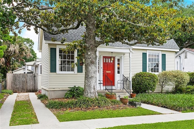 403 Athania Pkwy, Metairie, LA 70001 - bungalow-style home with fence and roof with shingles