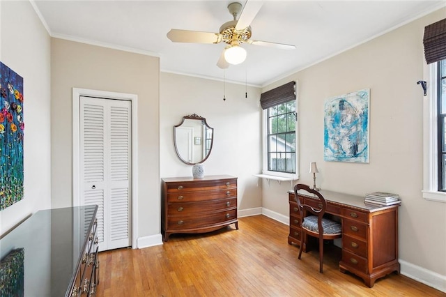 403 Athania Pkwy, Metairie, LA 70001 - home office with wood finished floors, baseboards, crown molding, and a ceiling fan