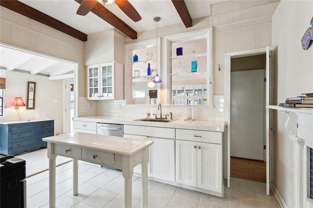 403 Athania Pkwy, Metairie, LA 70001 - kitchen with a sink, tile countertops, beamed ceiling, dishwasher, and ceiling fan