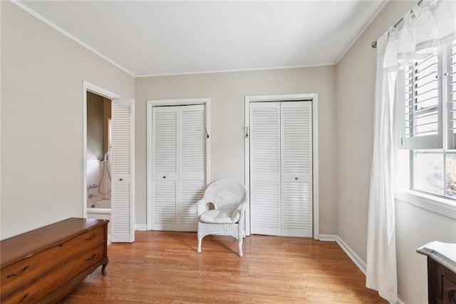 403 Athania Pkwy, Metairie, LA 70001 - living area featuring light wood finished floors, ornamental molding, and baseboards