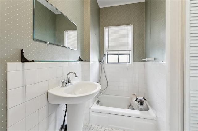403 Athania Pkwy, Metairie, LA 70001 - full bathroom with tile walls, wallpapered walls, bathing tub / shower combination, and a wainscoted wall