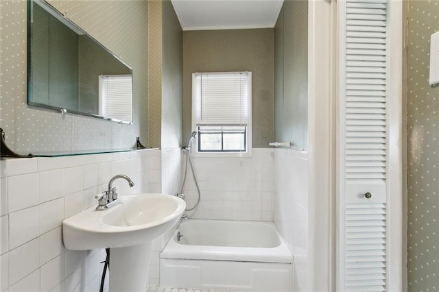 403 Athania Pkwy, Metairie, LA 70001 - full bathroom featuring wallpapered walls, tile walls, a closet, and wainscoting