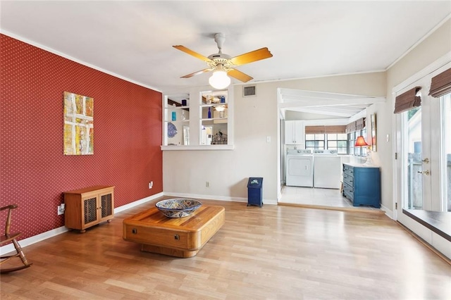 403 Athania Pkwy, Metairie, LA 70001 - living room with independent washer and dryer, crown molding, light wood-type flooring, a ceiling fan, and baseboards
