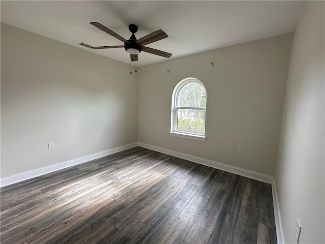 1561 Curtis St, Harvey, LA 70058 - unfurnished room featuring dark wood-style floors, a ceiling fan, and baseboards