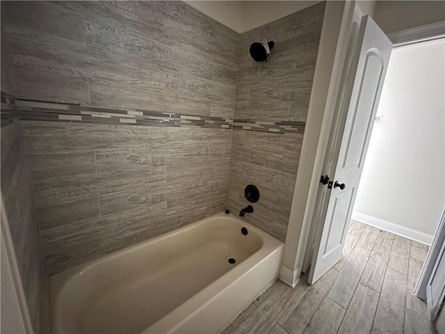 1561 Curtis St, Harvey, LA 70058 - full bath featuring wood finish floors, shower / washtub combination, and baseboards