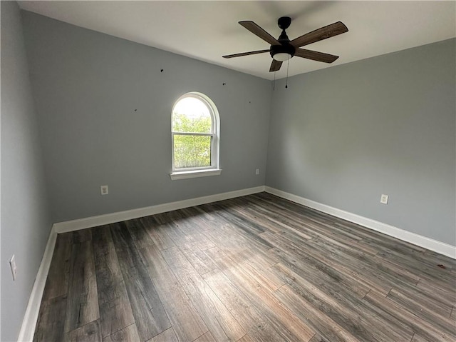 1561 Curtis St, Harvey, LA 70058 - unfurnished room with dark wood-type flooring, ceiling fan, and baseboards