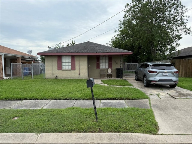 bungalow-style house with a gate, brick siding, concrete driveway, and roof with shingles