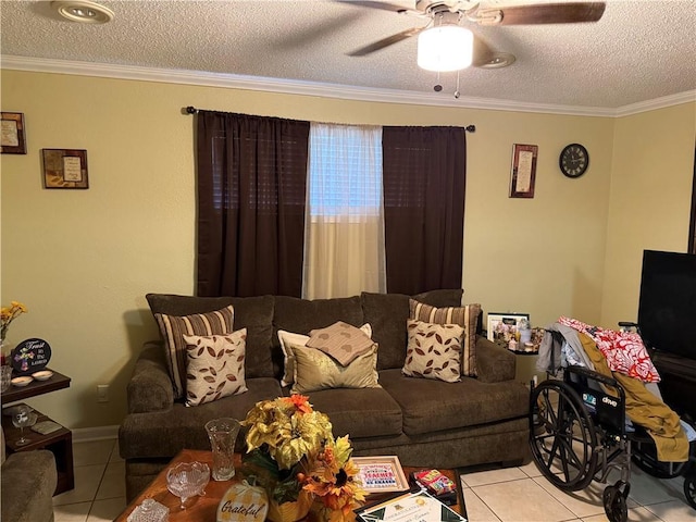 living room with tile patterned flooring, a textured ceiling, a ceiling fan, and ornamental molding