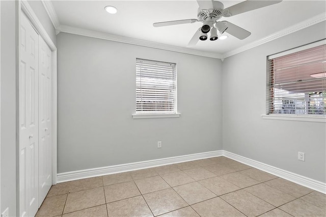 4933 Sanford St, Metairie, LA 70006 - unfurnished bedroom featuring a closet, baseboards, crown molding, light tile patterned floors, and ceiling fan