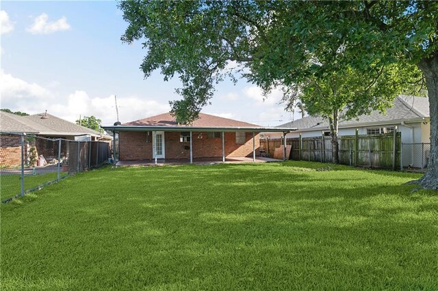 4933 Sanford St, Metairie, LA 70006 - rear view of property with a patio area