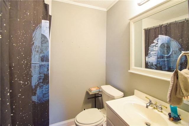 bathroom featuring ornamental molding, toilet, vanity, and curtained shower