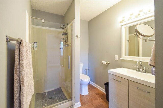 71 Mason St, Gretna, LA 70053 - bathroom featuring a shower stall, toilet, vanity, and baseboards