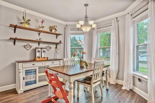 700 Kent Ave, Metairie, LA 70001 - dining space with a chandelier, crown molding, baseboards, and wood finished floors