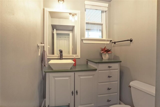 700 Kent Ave, Metairie, LA 70001 - half bathroom featuring toilet and vanity