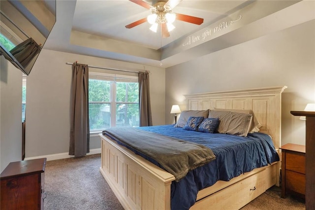 700 Kent Ave, Metairie, LA 70001 - carpeted bedroom with baseboards, a ceiling fan, and a tray ceiling
