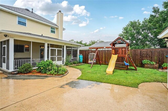 700 Kent Ave, Metairie, LA 70001 - view of yard with a sunroom, a playground, and a patio