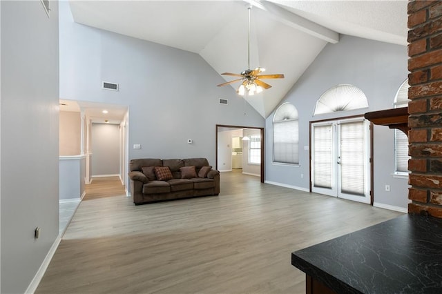 602 Willowdale Blvd, Luling, LA 70070 - living area featuring ceiling fan, high vaulted ceiling, wood finished floors, baseboards, and beam ceiling