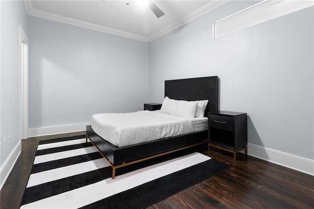 bedroom featuring ornamental molding, wood finished floors, baseboards, and ceiling fan