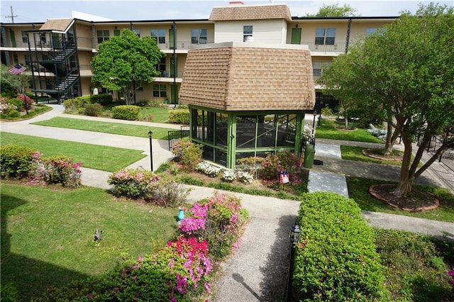 view of community with a lawn