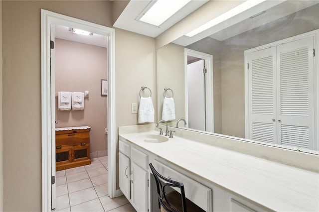 bathroom with vanity and tile patterned flooring