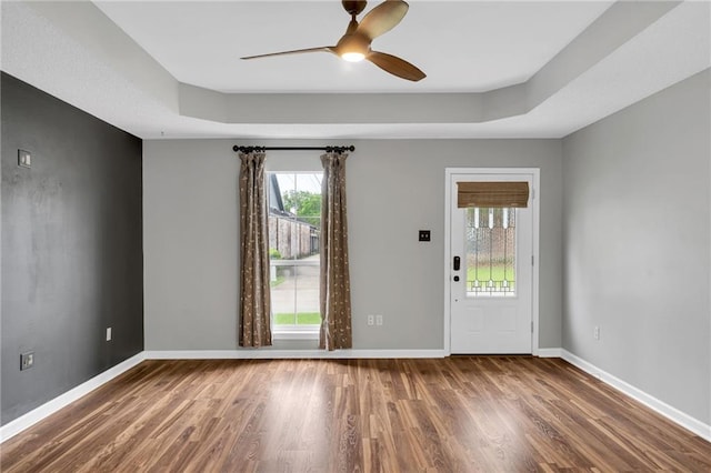 3737 James Victor Dr, Baton Rouge, LA 70817 - empty room featuring wood finished floors, ceiling fan, baseboards, and a raised ceiling